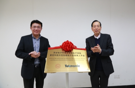 A person holding a sign posing for the camera

Description generated with very high confidence