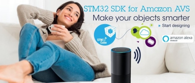 A woman on a sofa listening to a smart speaker