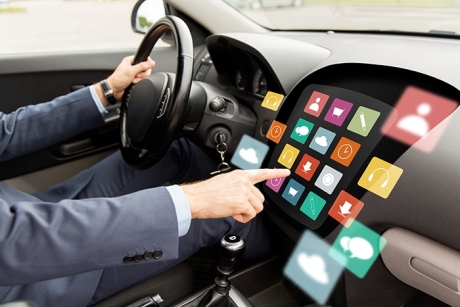 transport, modern technology, multimedia, business and people concept - close up of man driving car with menu icons on board computer screen